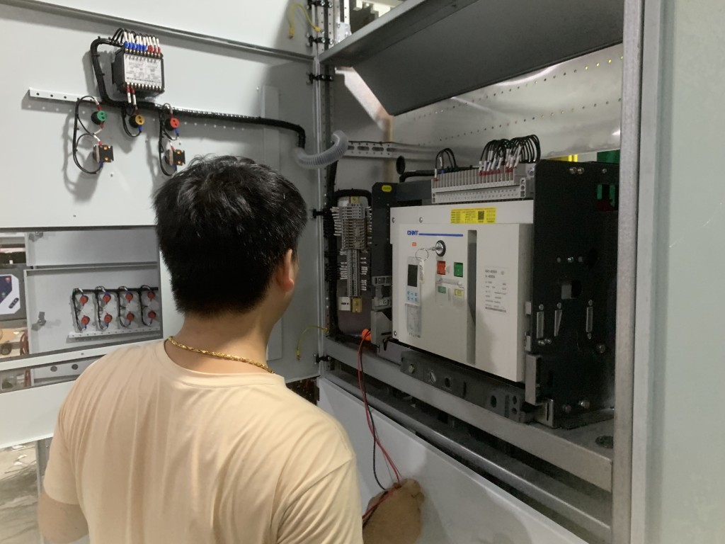 Factory testing of a motor control center panel with test equipment connected