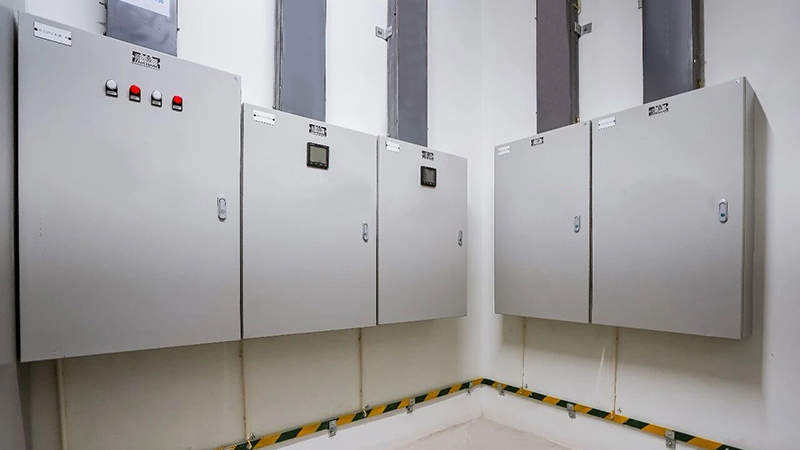 commercial building electrical room with lighting distribution panel and power distribution board