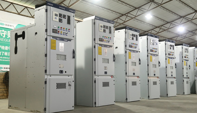 metal clad switchgear lineup kyn28a panels arranged in factory warehouse showing front and side perspective of multiple cabinets with vcb and 1250a labels